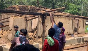 When former minister caught shovel and flood affected huts